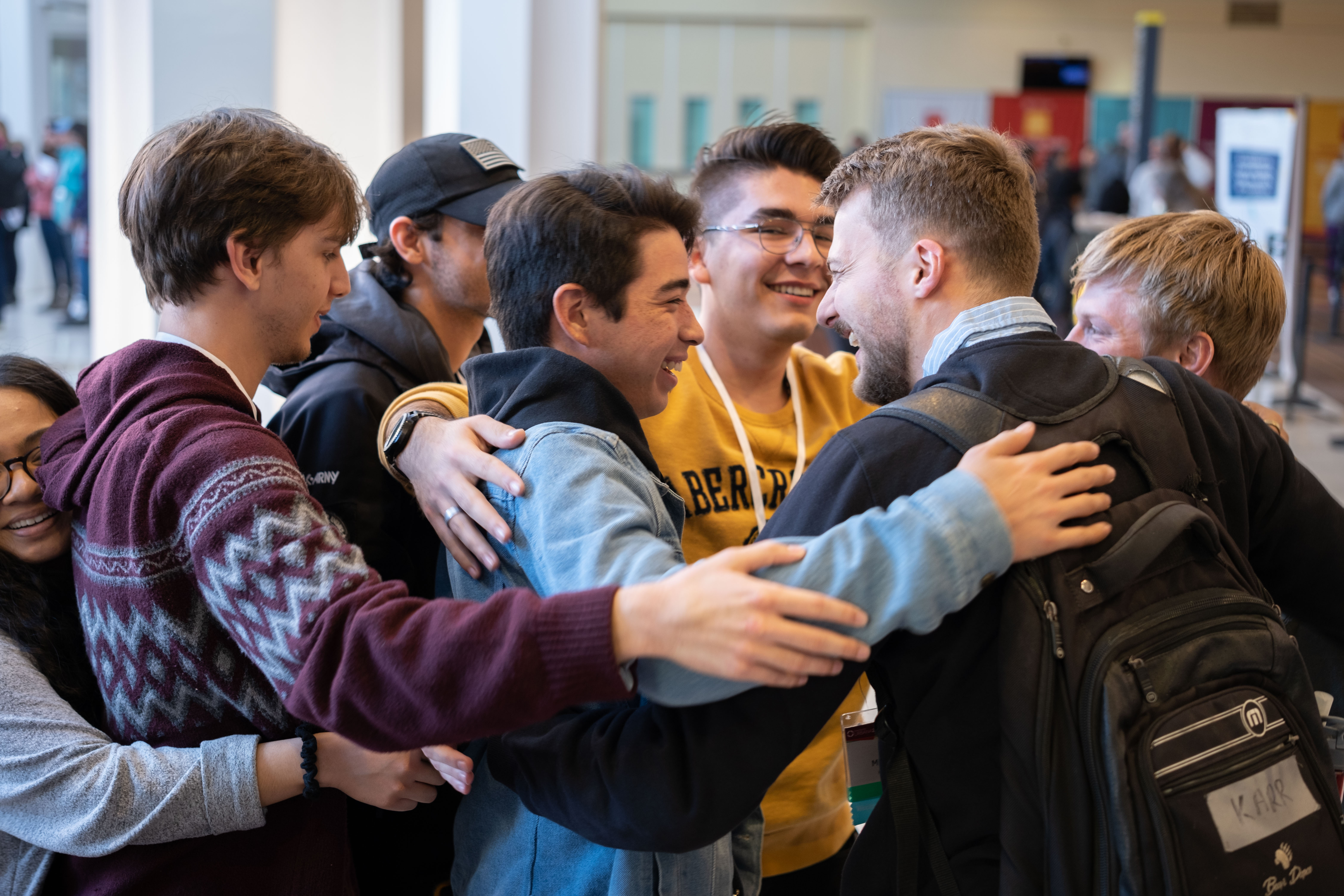 students hugging in a group