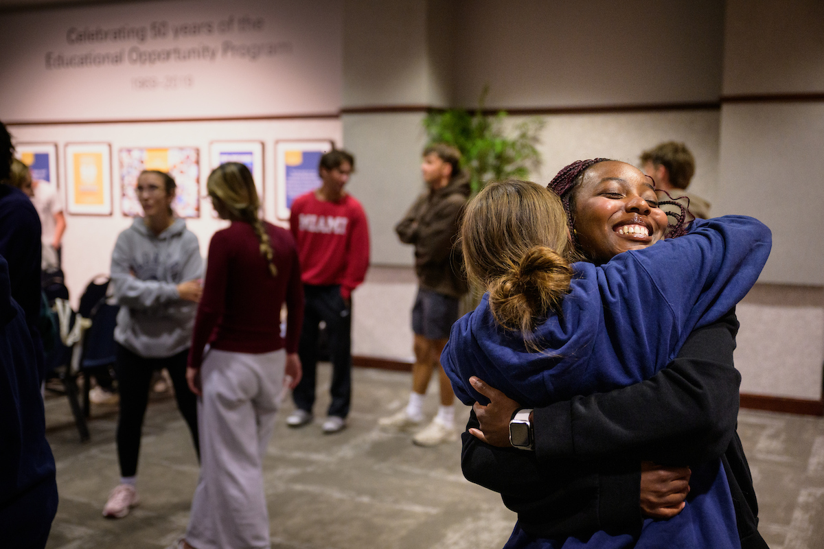 Two students hugging at an InterVarsity gathering