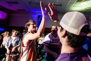 students giving high five