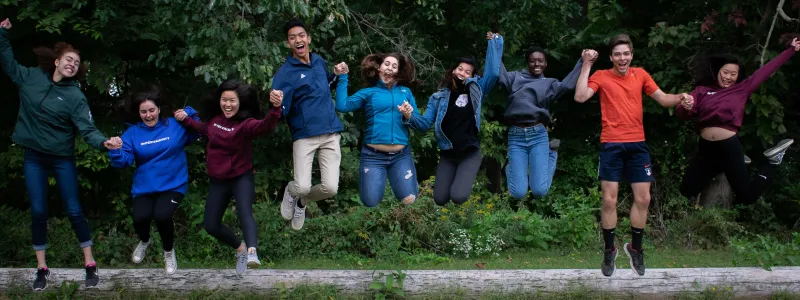 a group of people jumping in the air
