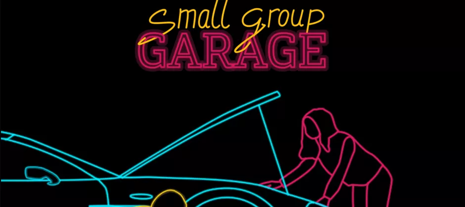 Neon sign saying "small group garage" with a outline person checking the hood of a car