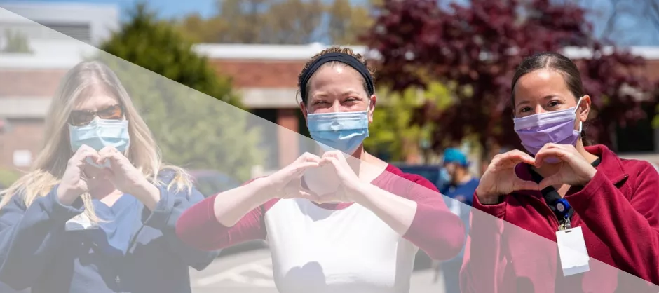 3 nursing students making hearts with their hands