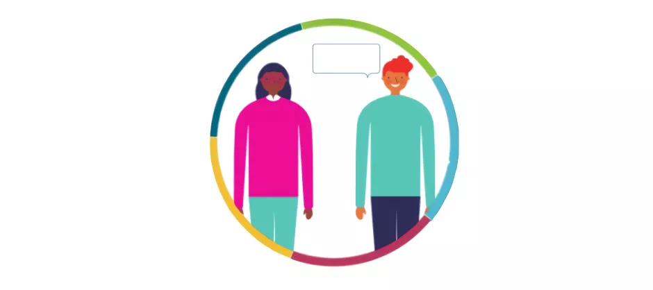 two people standing inside of a multicolor ring