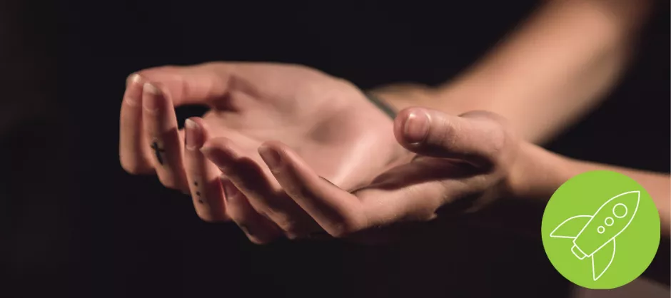 hands positioned palms up in prayer