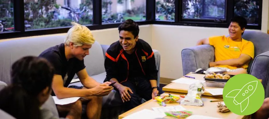 students sitting on couches talking to each other