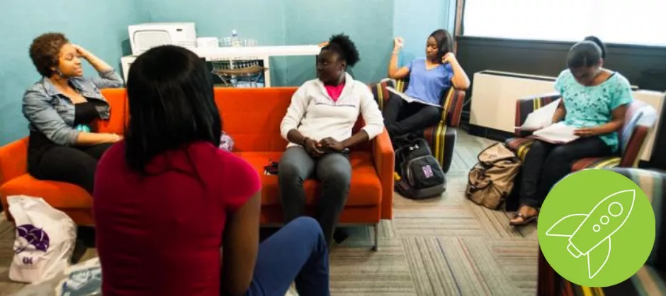 group of students sitting in a common area together