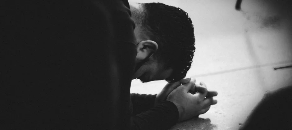 Engaging in Confession Prayer banner (person on the ground praying)