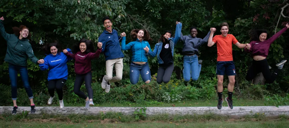 a group of people jumping in the air