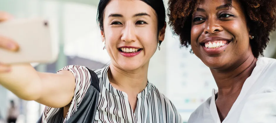 two adults taking a selfie