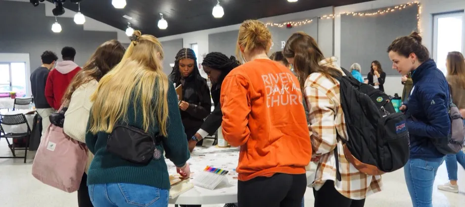 students gathered around a table