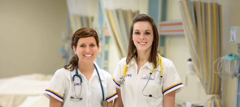 two nurses standing in a hospital
