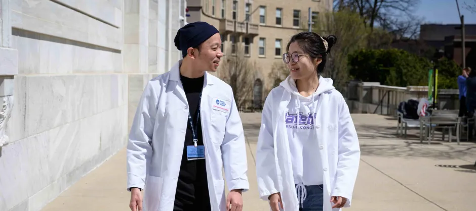 2 students walking and talking