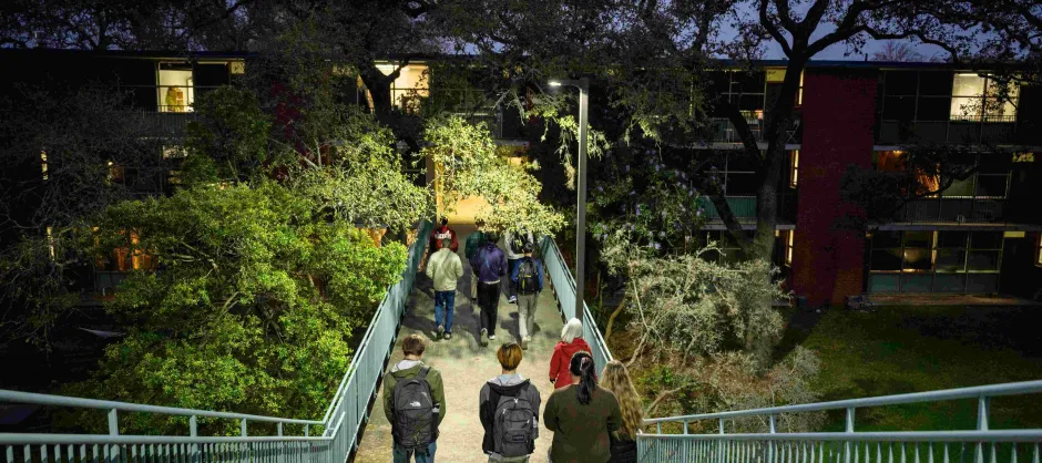 students walking down campus stairs