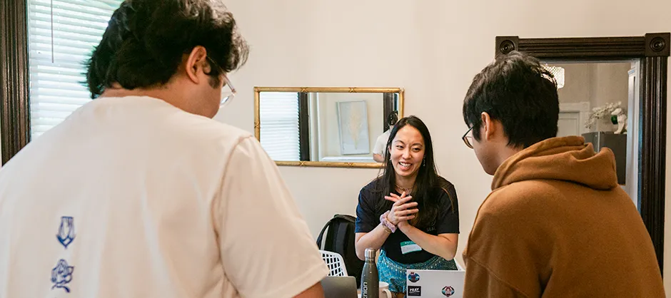three students talking