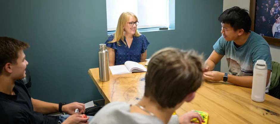 Four people sitting around a table