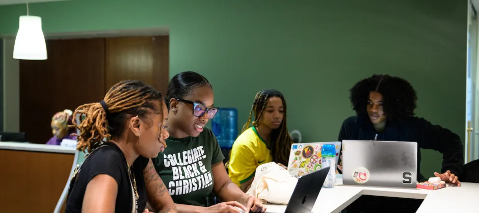 Students looking at computers