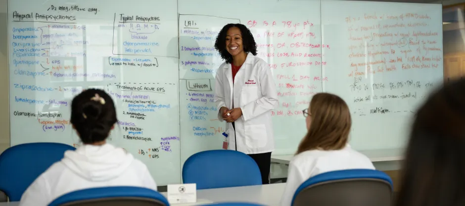 Woman teaching in white coat
