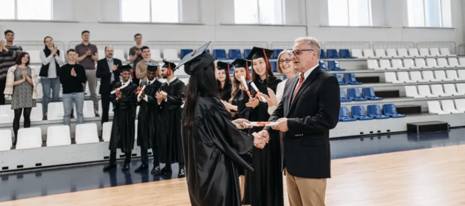 Student being given diploma