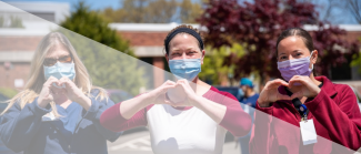 3 nursing students making hearts with their hands