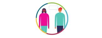 two people standing inside of a multicolor ring