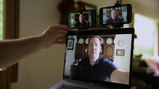 Videographer Matt Kirk showing his impressive set up recording video with phones and a laptop