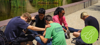 students sitting and praying together