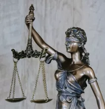 a photo of blindfolded lady justice holding the scales of justice