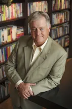 Sandy Shugart leaning on a desk