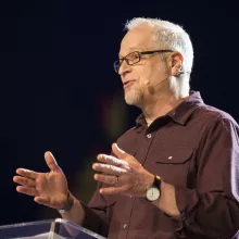 Image of Scott Bessenecker preaching at a pulpit