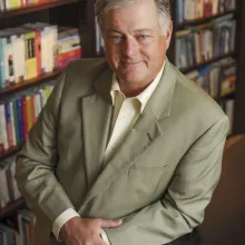 Sandy Shugart leaning on a desk